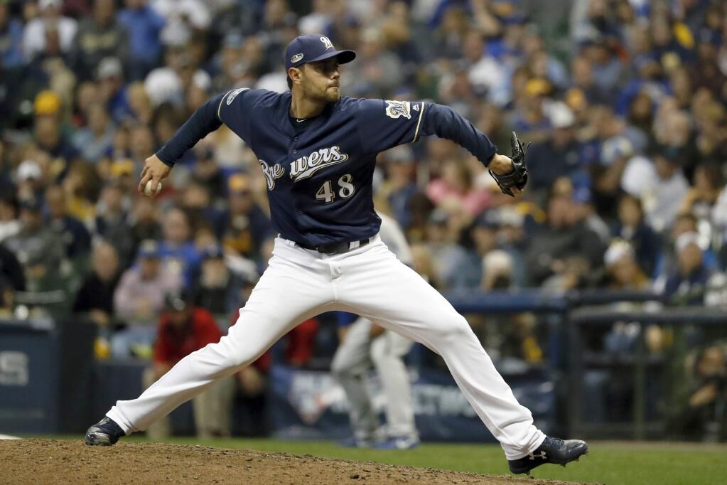 In this Oct. 12, 2018, file photo, Milwaukee Brewers relief pitcher Joakim Soria throws during the eighth inning of Game 1 of the National League Championship Series against the Los Angeles Dodgers, in Milwaukee. (AP Photo/Jeff Roberson, File)