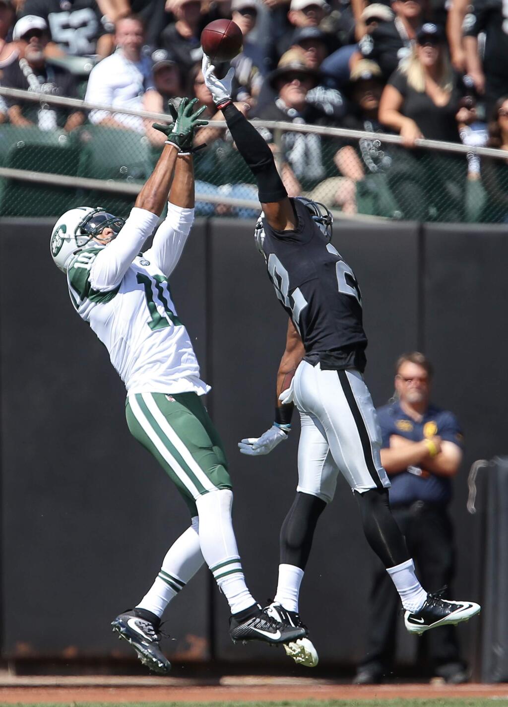 Oakland Raiders cornerback Gareon Conley bats away a pass intended for New York Jets wide receiver Jermaine Kearse, during their game in Oakland on Sunday, September 17, 2017. (Christopher Chung/ The Press Democrat)