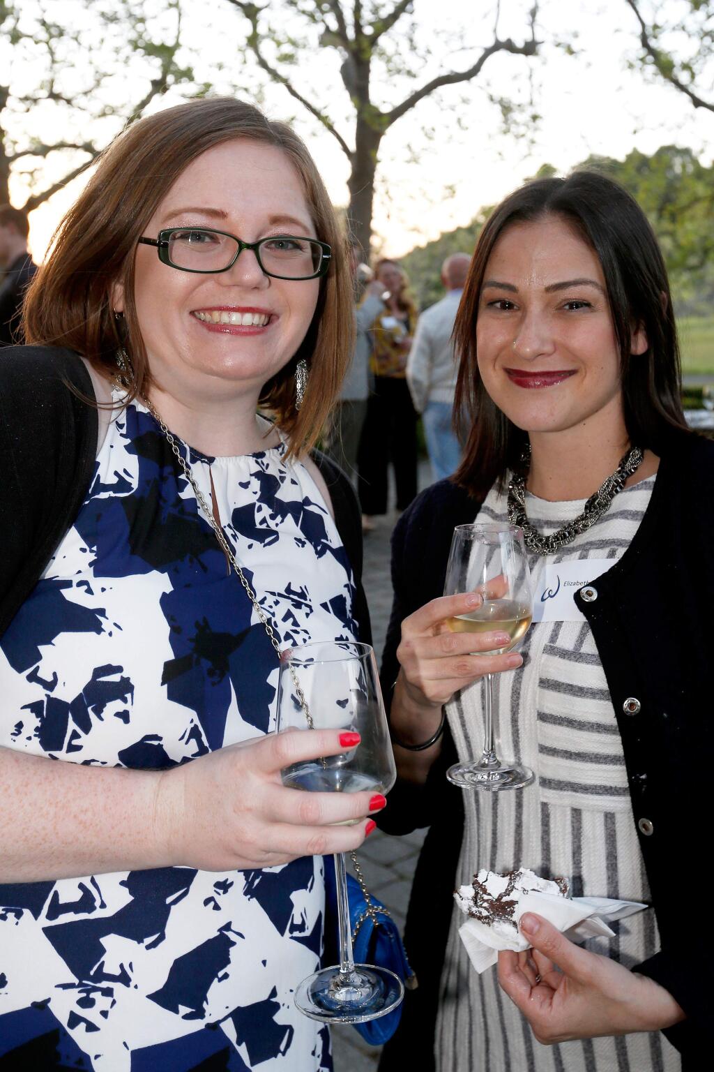 Sara Roberts, left, and Elizabeth Huayllara attend Reading Between the Vines, a fundraiser for United Way of the Wine Country's education initiatives, at Jordan Vineyard and Winery in Healdsburg, California, on Friday, March 31, 2017. (Alvin Jornada / The Press Democrat)