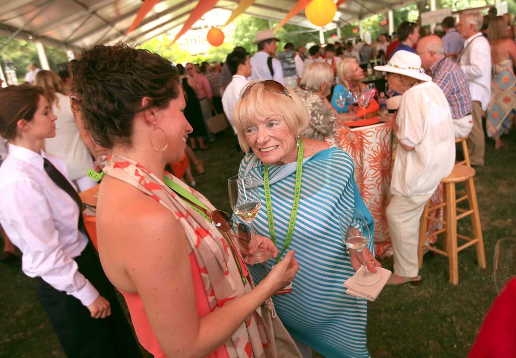 Margrit Mondavi talks to a woman who didn't want to be identified at Auction Napa Valley, Saturday June 1, 2013 at Meadowood Resort in St. Helena. (Kent Porter / Press Democrat) 2013