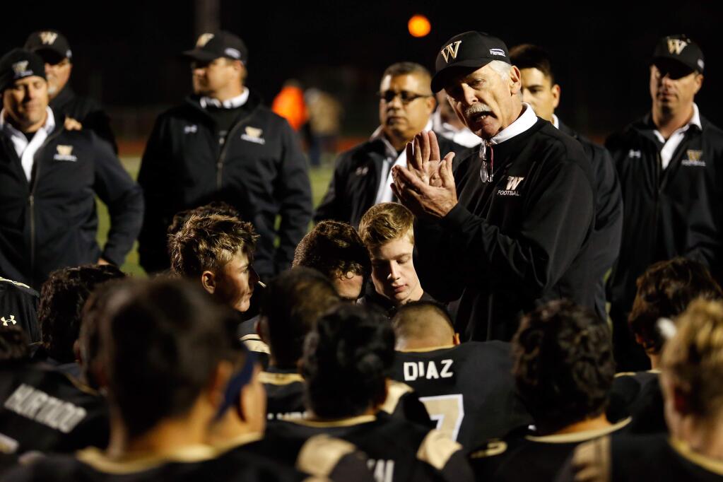 Windsor head coach Tom Kirkpatrick congratulates his team on their 38-37 overtime victory against Santa Rosa in the NCS Division 2 quarterfinal football game, in Windsor, California on Friday, November 18, 2016. (Alvin Jornada / The Press Democrat)