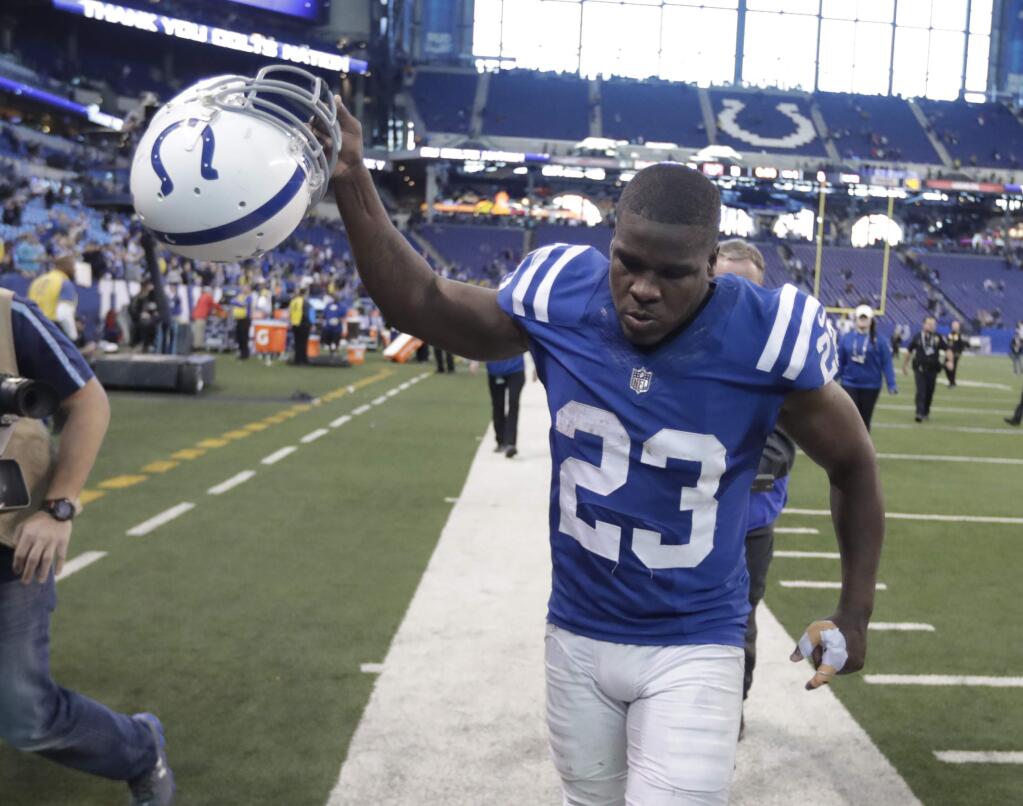 The Indianapolis Colts' Frank Gore runs off the field following a game against the Houston Texans, Sunday, Dec. 31, 2017, in Indianapolis. Indianapolis won 22-13. (AP Photo/Michael Conroy)