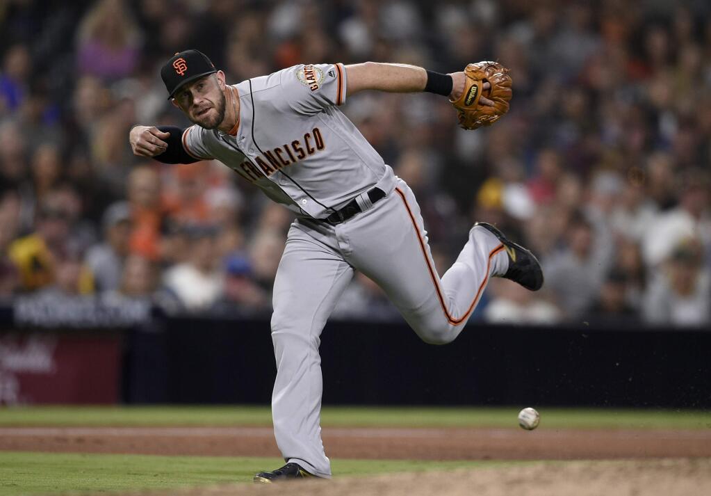 San Francisco Giants third baseman Evan Longoria is unable to field a ball hit by San Diego Padres' Christian Villanueva during the fifth inning in San Diego, Friday, April 13, 2018. (AP Photo/Kelvin Kuo)