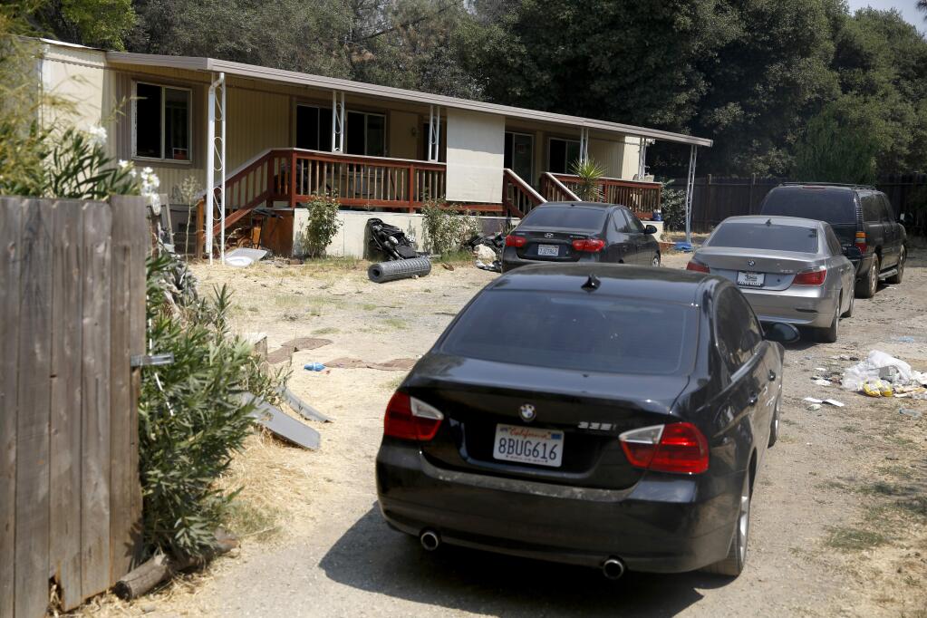 The driveway of a Yarrington Court home after Ricardo Lopez shot his 4 children, killing 3, in an SUV and then committed suicide in the driveway. Photo taken in Clearlake on Sunday, August 12, 2018. (Beth Schlanker/ The Press Democrat)