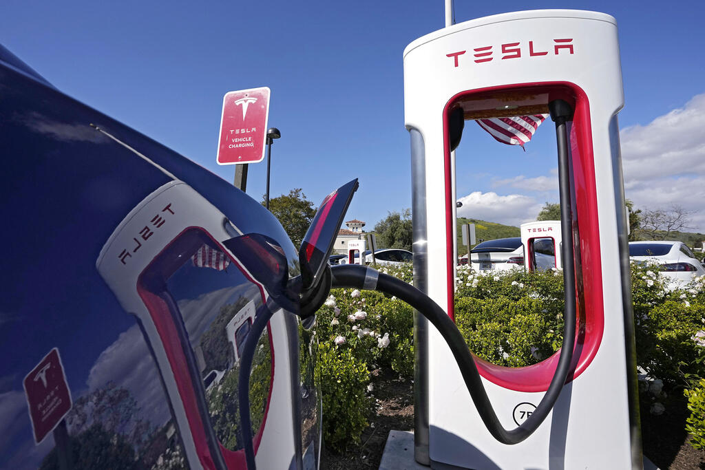 FILE — Tesla electric vehicles are seen at Tesla chargers, May 10, 2023, in Westlake, Calif. (AP Photo/Mark J. Terrill, File)