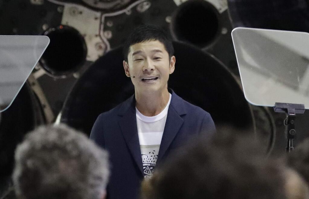 Japanese billionaire Yusaku Maezawa speaks after SpaceX founder and chief executive Elon Musk announced him as the person who would be the first private passenger on a trip around the moon, Monday, Sept. 17, 2018, in Hawthorne, Calif. (AP Photo/Chris Carlson)