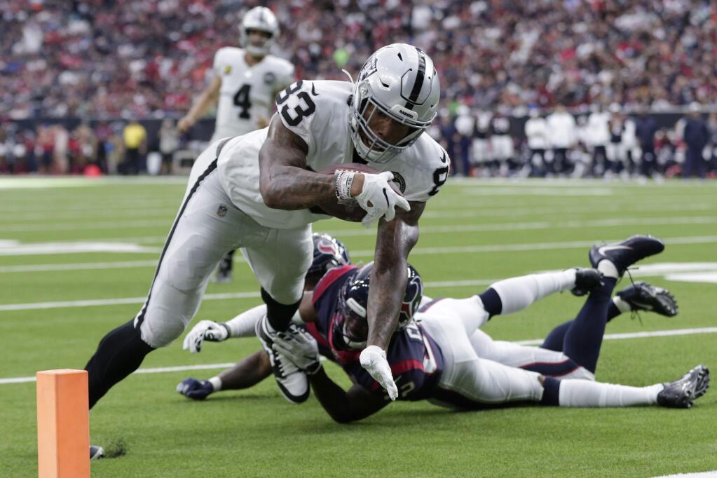 Oakland Raiders tight end Darren Waller scores a touchdown against the Houston Texans during the first half Sunday, Oct. 27, 2019, in Houston. (AP Photo/Michael Wyke)