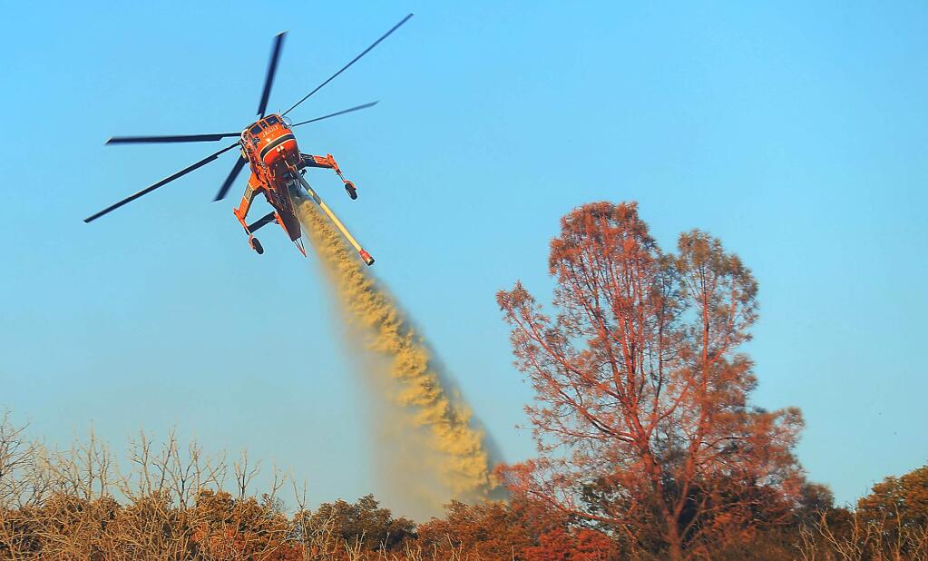 A helitanker stationed at the Sonoma Air Attack Base was used to fight the Bottle fire in Kelseyville at highways 175 and 129 on Tuesday, Aug. 8, 2017. (KENT PORTER/ PD)