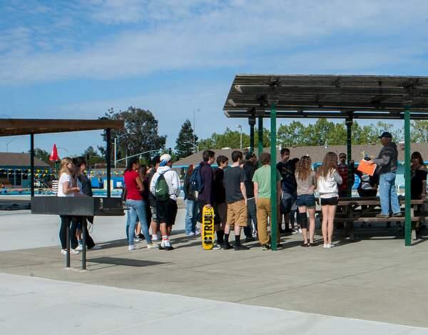 Parks and recreation commissioner Steve Klotz presents the days program to the youth volunteers at the Petaluma Swim Center Saturday, April 11,2015 (John O'Hara For The Argus-Courier)