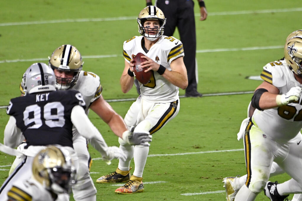 New Orleans Saints quarterback Drew Brees (9) drops back to pass against the Las Vegas Raiders during the first half of an NFL football game, Monday, Sept. 21, 2020, in Las Vegas. (AP Photo/David Becker)