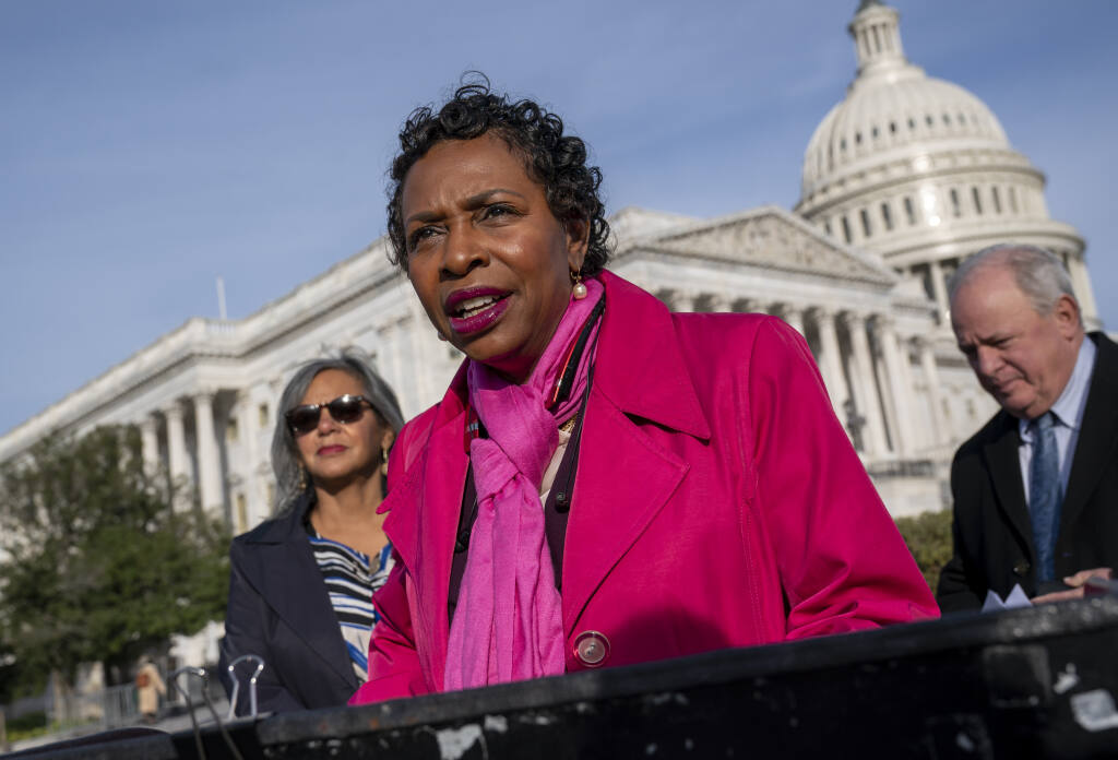 Rep. Yvette Clarke, D-N.Y., flanked by Rep. Robin Kelly, D-Ill., left, and Rep. Mike Doyle, D-Pa., holds a news conference at the Capitol in Washington, Nov. 4, 2021. Legislation that would require candidates to label campaign advertisements created with AI has been introduced in the House by Clarke, who has also sponsored legislation that would require anyone creating synthetic images to add a watermark indicating the fact. (AP Photo/J. Scott Applewhite, File)