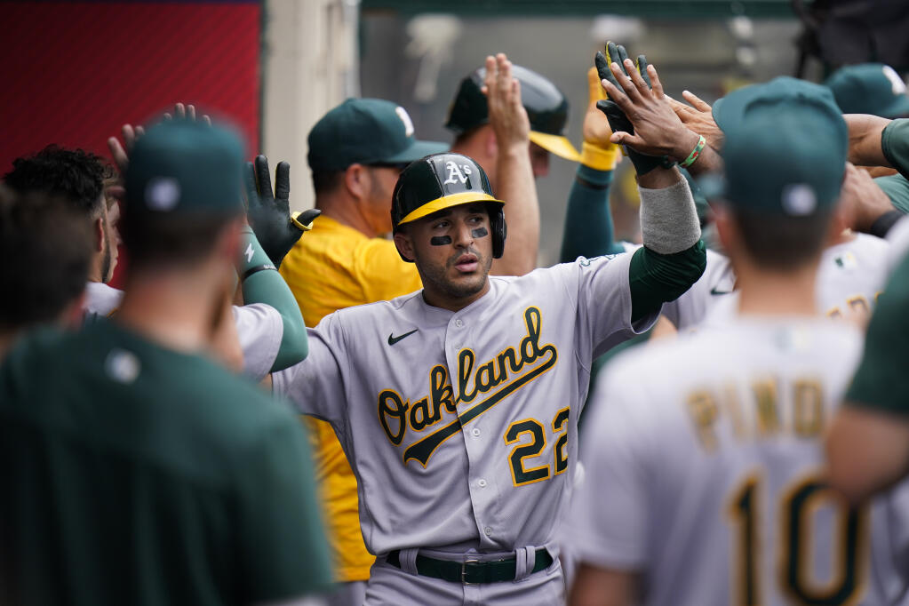 The A’s Ramon Laureano, center, is congratulated by teammates after hitting a two-run home run during the fourth inning against the Los Angeles Angels Thursday, Aug. 4, 2022, in Anaheim. (Jae C. Hong / ASSOCIATED PRESS)