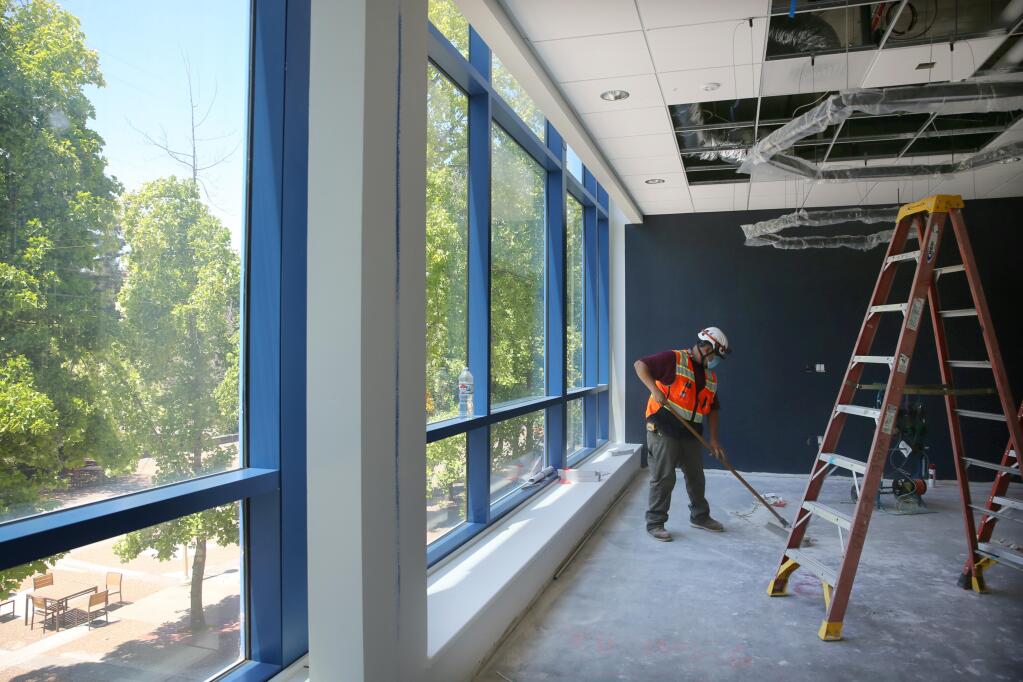Daniel Contreras, a foreman with Swinerton, works on renovating office space for the SSU president Dr. Judy K. Sakaki at Salazar Hall on the Sonoma State University campus in Rohnert Park on Wednesday, July 22, 2020. (Beth Schlanker/ The Press Democrat)