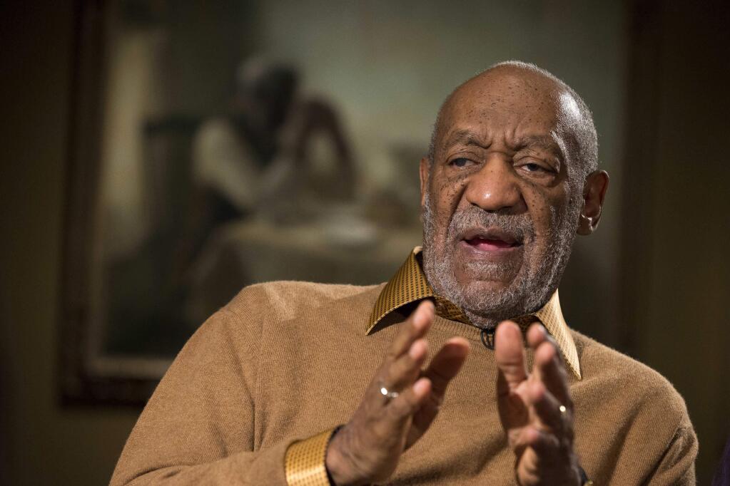 FILE - In this Nov. 6, 2014 file photo, entertainer Bill Cosby gestures during an interview at the Smithsonian's National Museum of African Art in Washington. Lawyers for Bill Cosby argue in a new court filing his admission he used quaaludes in the 1970s doesn't mean he drugged and sexually assaulted women. The lawyers on Tuesday, July 21, 2015, asked a court to preserve the confidentiality of his 2006 settlement in a sexual-battery lawsuit. (AP Photo/Evan Vucci, File)