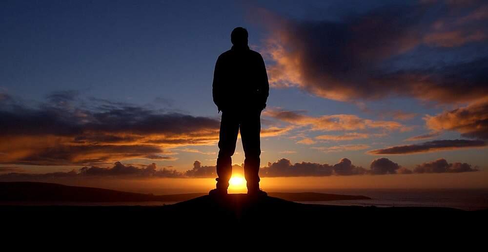 Steve Clark of Sebastopol watches the sunset over Tomales Bay on the first day of winter. (File photo/The Press Democrat)