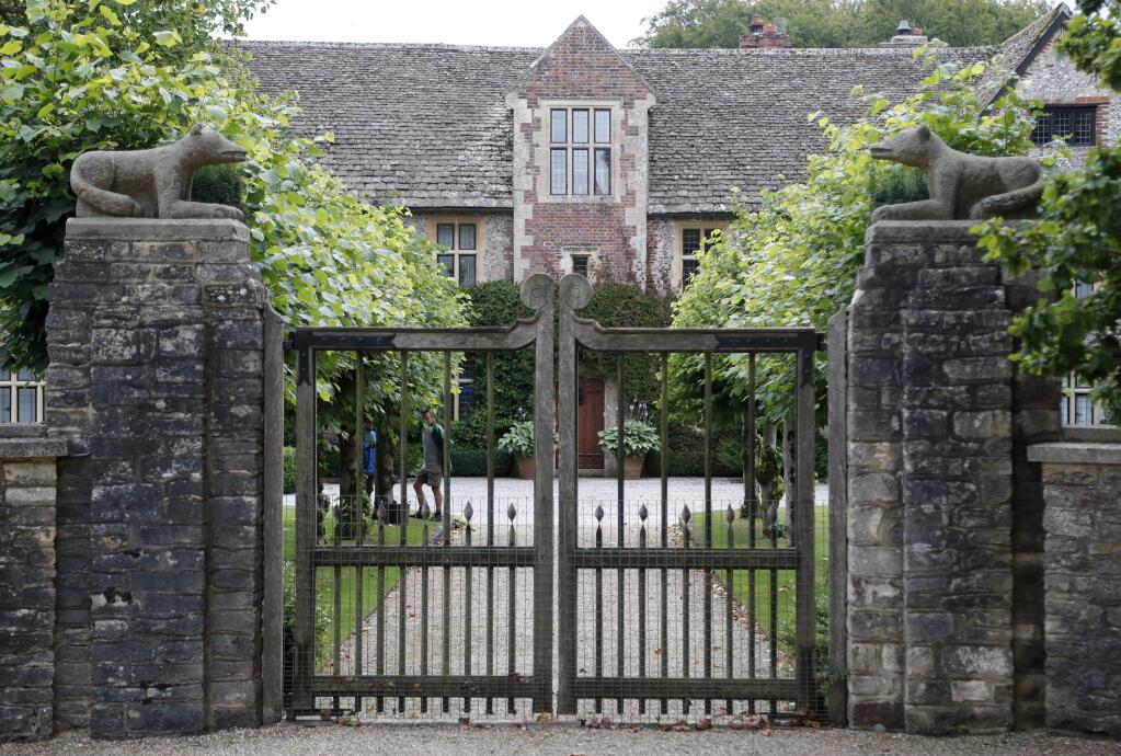 FILE - In this Tuesday, Aug. 6, 2019 file photo is the entrance of the Rooksnest estate near Lambourn, England. The property belongs to the Sackler family, owners of Purdue Pharma based in Stamford, Conn. The allegations surrounding wealthy donors such as the Sackler family have raised questions for the museums they supported, including whether to keep the family's name on prominent galleries. (AP Photo/Frank Augstein, File)