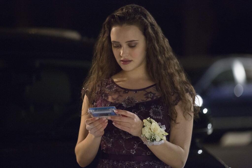 This image released by Netflix shows Katherine Langford in a scene from the series, '13 Reasons Why,' about a teenager who commits suicide. (Beth Dubber/Netflix via AP)