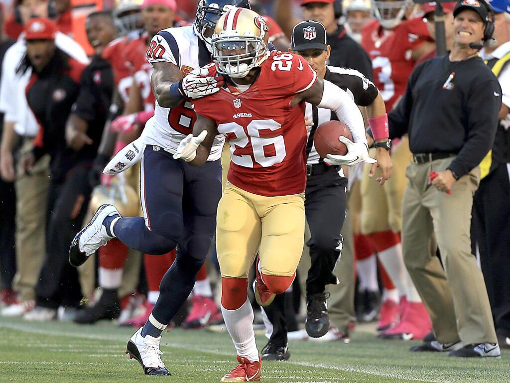 Tramaine Brock of San Francisco gets his second interception of the night against the Texan's Andre Johnson at Candlestick Park in San Francisco on Sunday, Oct. 6, 2013. (KENT PORTER/ PD FILE)