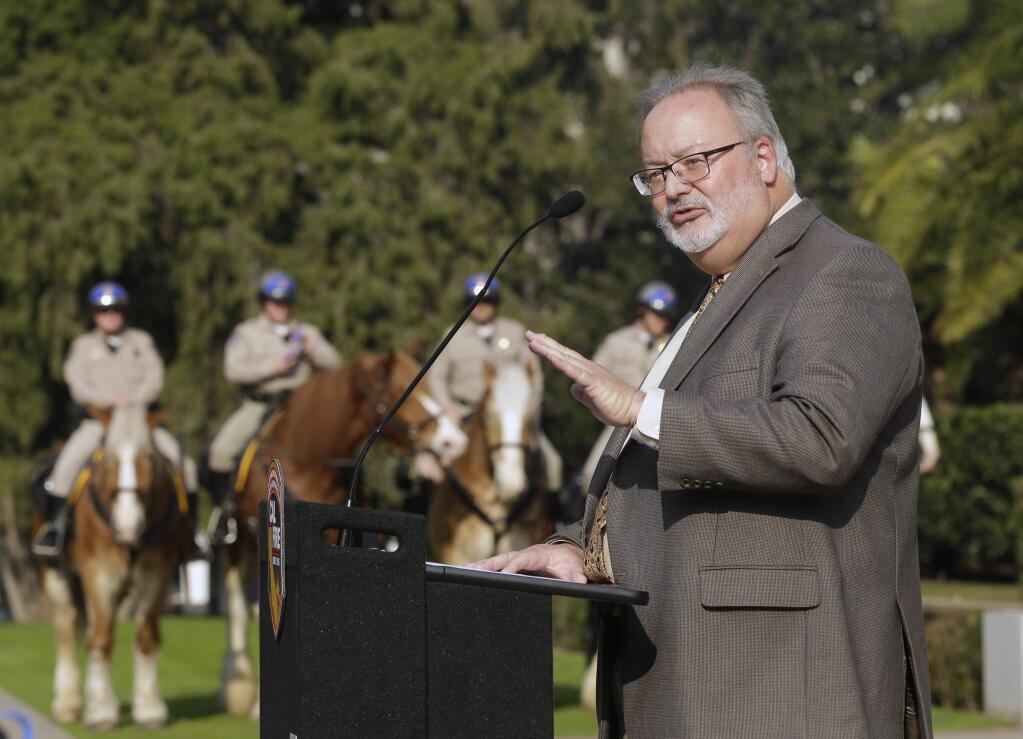 Board of Forestry and Fire Protection Chairman Keith Gilless, discusses the plan to speed up logging and prescribed burns designed to protect communities from wildfires, at a news conference Tuesday, Jan. 29, 2019, in Sacramento, Calif. The effort would create a single environmental review process to cover vegetation reduction projects, field breaks and restoration projects. (AP Photo/Rich Pedroncelli)