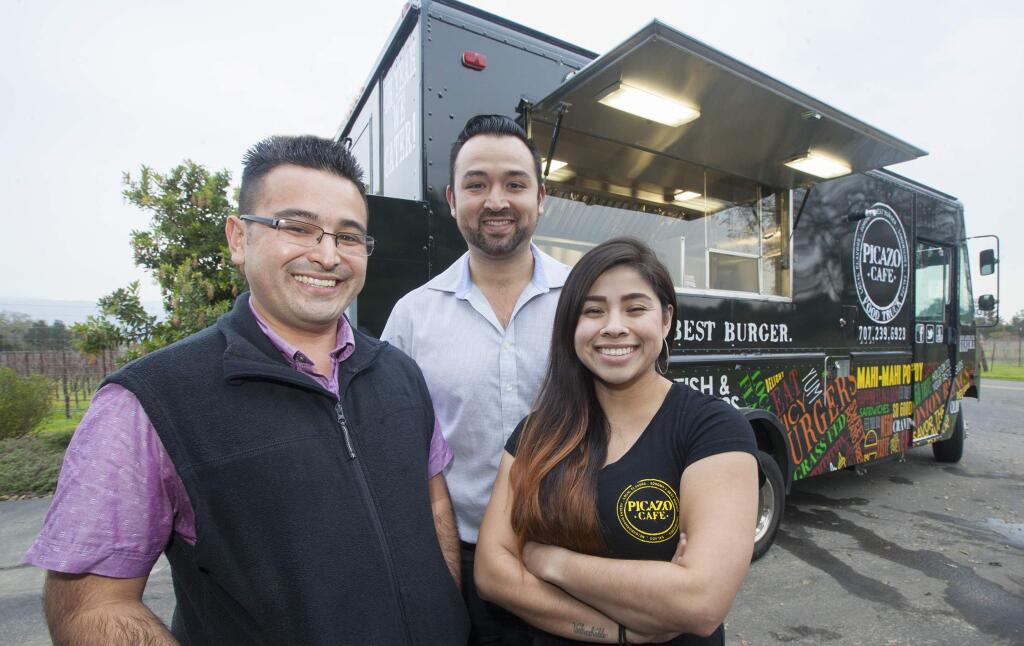 In front of the new Picazo food truck are (from left) Aiki Terashima, partner, Salvador Picazo, partner, Doris Martinez Picazo, food truck manager. (Photo by Robbi Pengelly/Index-TribuneO