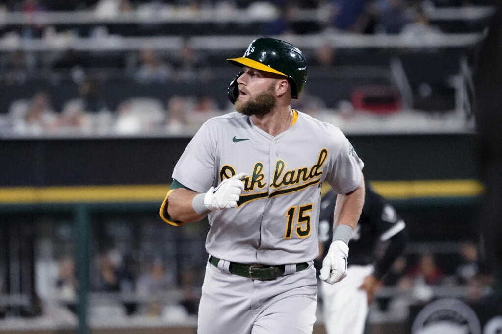 The Oakland Athletics’ Seth Brown looks toward the left field bleachers where his home run off Chicago White Sox starting pitcher Lance Lynn landed in the fourth inning on Wednesday, Aug. 18, 2021, in Chicago. (Charles Rex Arbogast / ASSOCIATED PRESS)