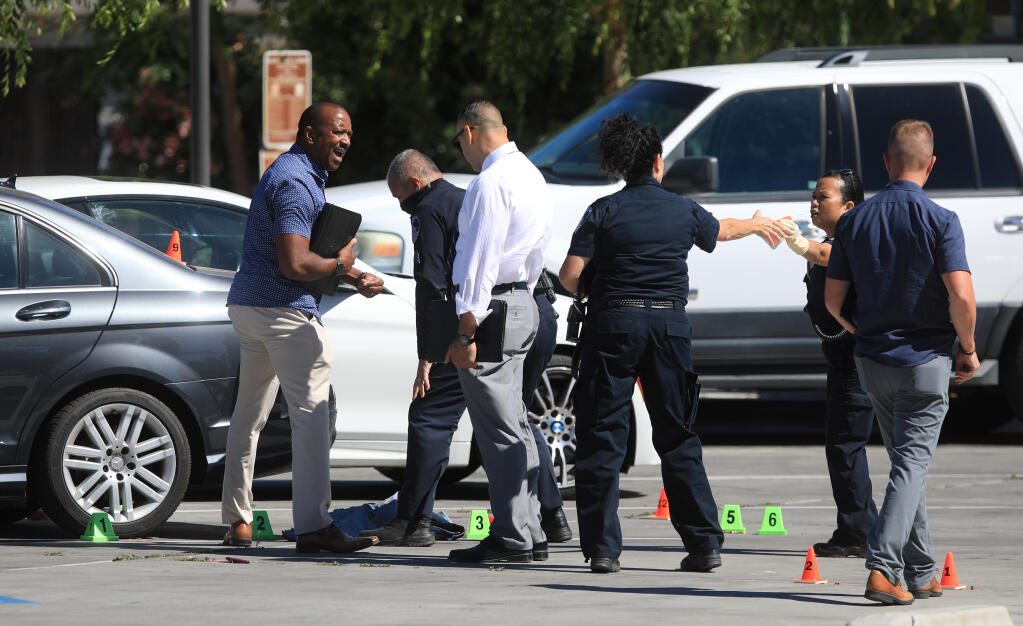 Santa Rosa police begin to gather information in a shooting in the parking lot of Bayer Park & Gardens at West Avenue and Rose Meadow Court, Wednesday, June 9, 2021, in Santa Rosa. (Kent Porter / The Press Democrat)