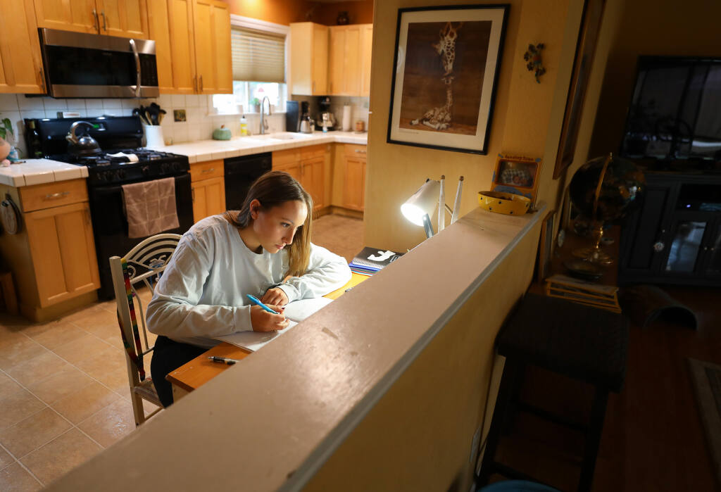 Rancho Cotate high school senior Lauren Poteet works on her Algebra 2 homework at her home in Rohnert Park on Friday, Nov. 13, 2020.  (Christopher Chung/ The Press Democrat)