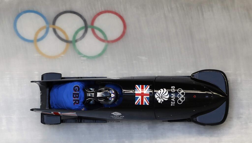 Driver Brad Hall and Joel Fearon of Britain take a practice run during training for the two-man bobsled at the 2018 Winter Olympics in Pyeongchang, South Korea, Thursday, Feb. 15, 2018. (AP Photo/Andy Wong)