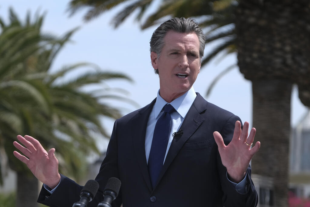 FILE - In this Tuesday, June 15, 2021, file photo, California Gov. Gavin Newsom talks during a news conference at Universal Studios in Universal City, Calif. (AP Photo/Ringo H.W. Chiu, File)