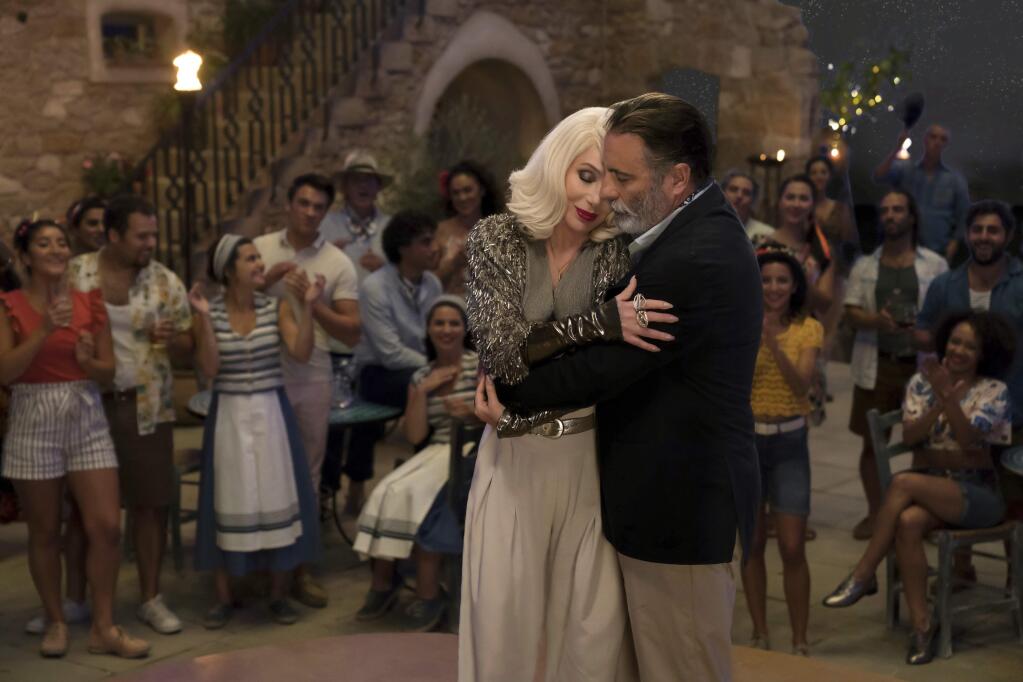 This image released by Universal Pictures shows Cher, left, and Andy Garcia in a scene from 'Mamma Mia! Here We Go Again.' (Jonathan Prime/Universal Pictures via AP)