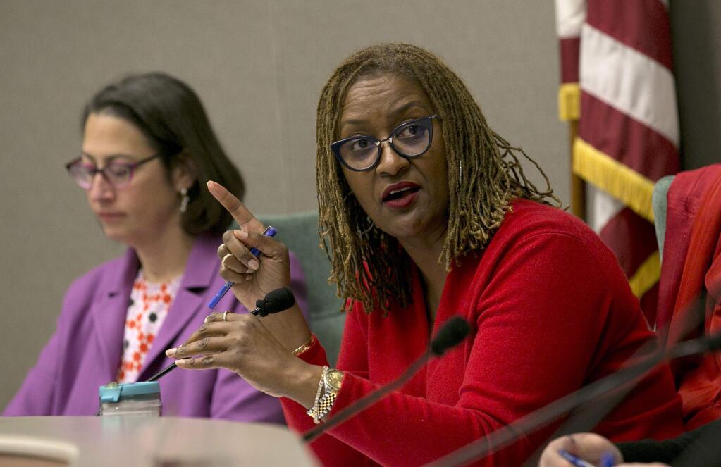 State Sen. Holly Mitchell, D-Los Angeles, right, vice chairwoman of a joint legislative committee on sexual harassment prevention and response, discusses the committees objectives Wednesday, Jan. 24, 2018, in Sacramento, Calif. Lawmakers from both houses joined together to start the process to reform the Legislature's policies for handling sexual harassment allegations. (AP Photo/Rich Pedroncelli)