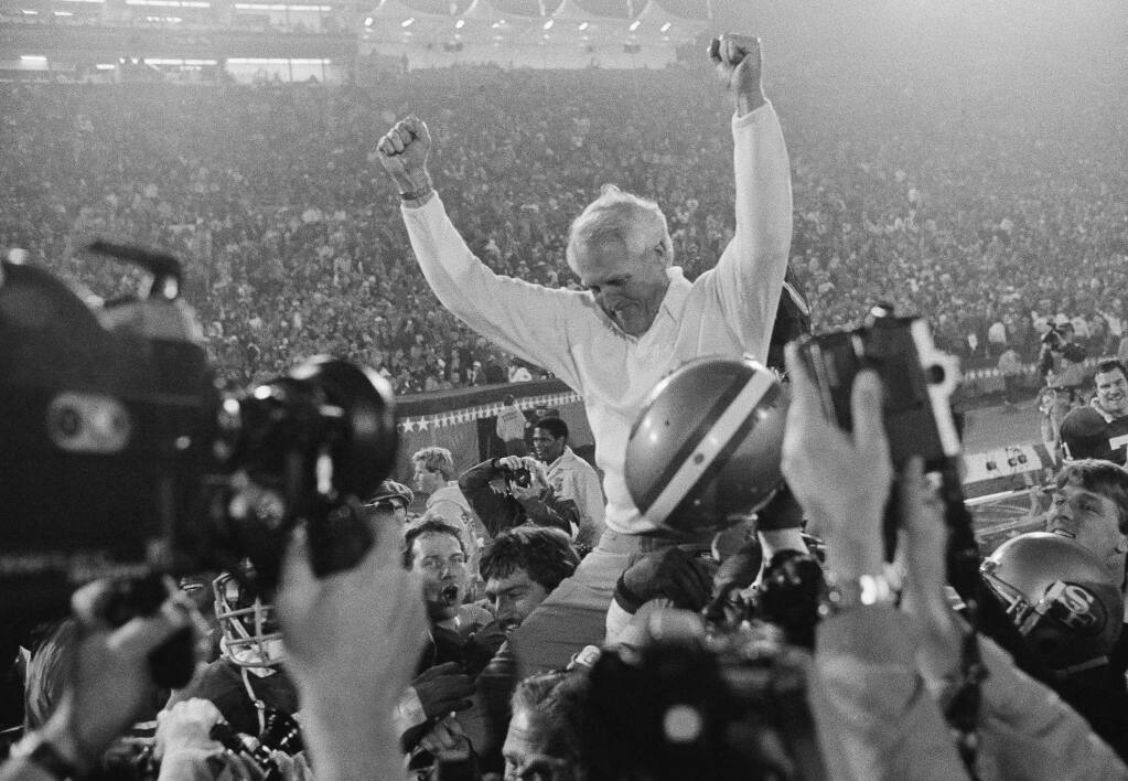 San Francisco 49ers coach Bill Walsh a ride off field on the shoulders of his team after they won a 38-16 victory over the Miami Dolphins in Super Bowl XIX, Sunday, Jan. 20, 1985 at Stanford Stadium. (AP Photo)