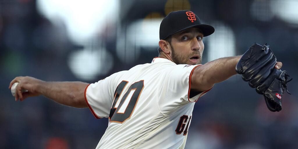 San Francisco Giants pitcher Madison Bumgarner works against the San Diego Padres during the first inning Thursday, June 21, 2018, in San Francisco. (AP Photo/Ben Margot)