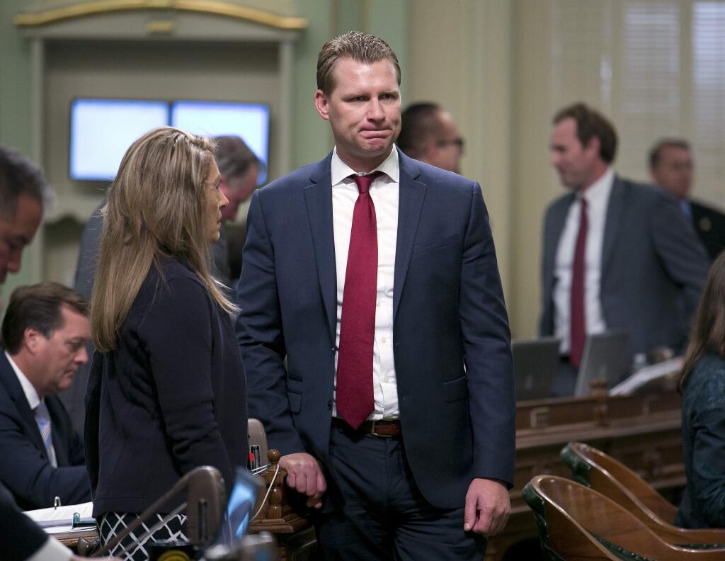 Assembly Republican Leader Chad Mayes, of Yucca Valley, right, talks with fellow GOP Assembly member Marie Waldron, of Escondido, at the Capitol Monday, Aug. 21, 2017, in Sacramento, Calif. Some California Republicans are looking to oust Mayes over his support for extending California's cap and trade legislation last month. (AP Photo/Rich Pedroncelli)