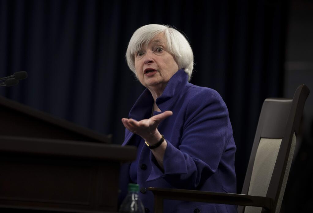 Federal Reserve Chair Janet Yellen speaks during a news conference following the Federal Open Market Committee meeting in Washington, Wednesday, Dec. 13, 2017. The Fed said Wednesday that it's lifting its short-term rate by a modest quarter-point to a still-low range of 1.25 percent to 1.5 percent. It is also continuing to slowly shrink its bond portfolio. Together, the two steps could lead over time to higher loan rates for consumers and businesses and slightly better returns for savers. (AP Photo/Carolyn Kaster)