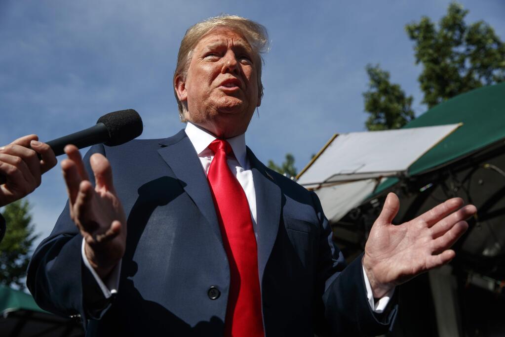 President Donald Trump speaks to reporters at the White House, Friday, June 15, 2018, in Washington. (AP Photo/Evan Vucci)