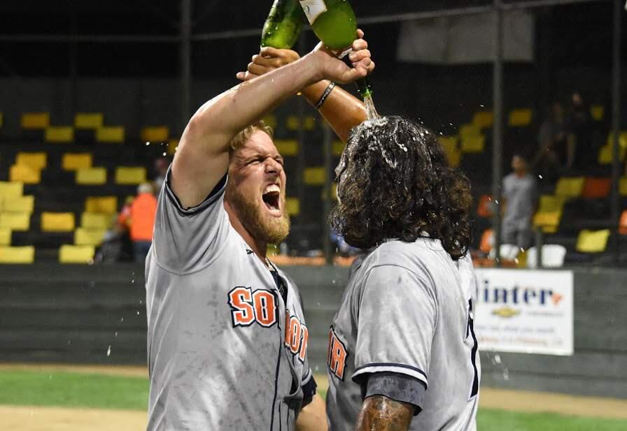 James W. Toy/Special to the Index-TribuneStompers Scott David, left, and Joel Carranza celebrate Wednesday after the Stompers 6-5 win over Pittsburg gave Sonoma the first-half title in the Pacific Association.