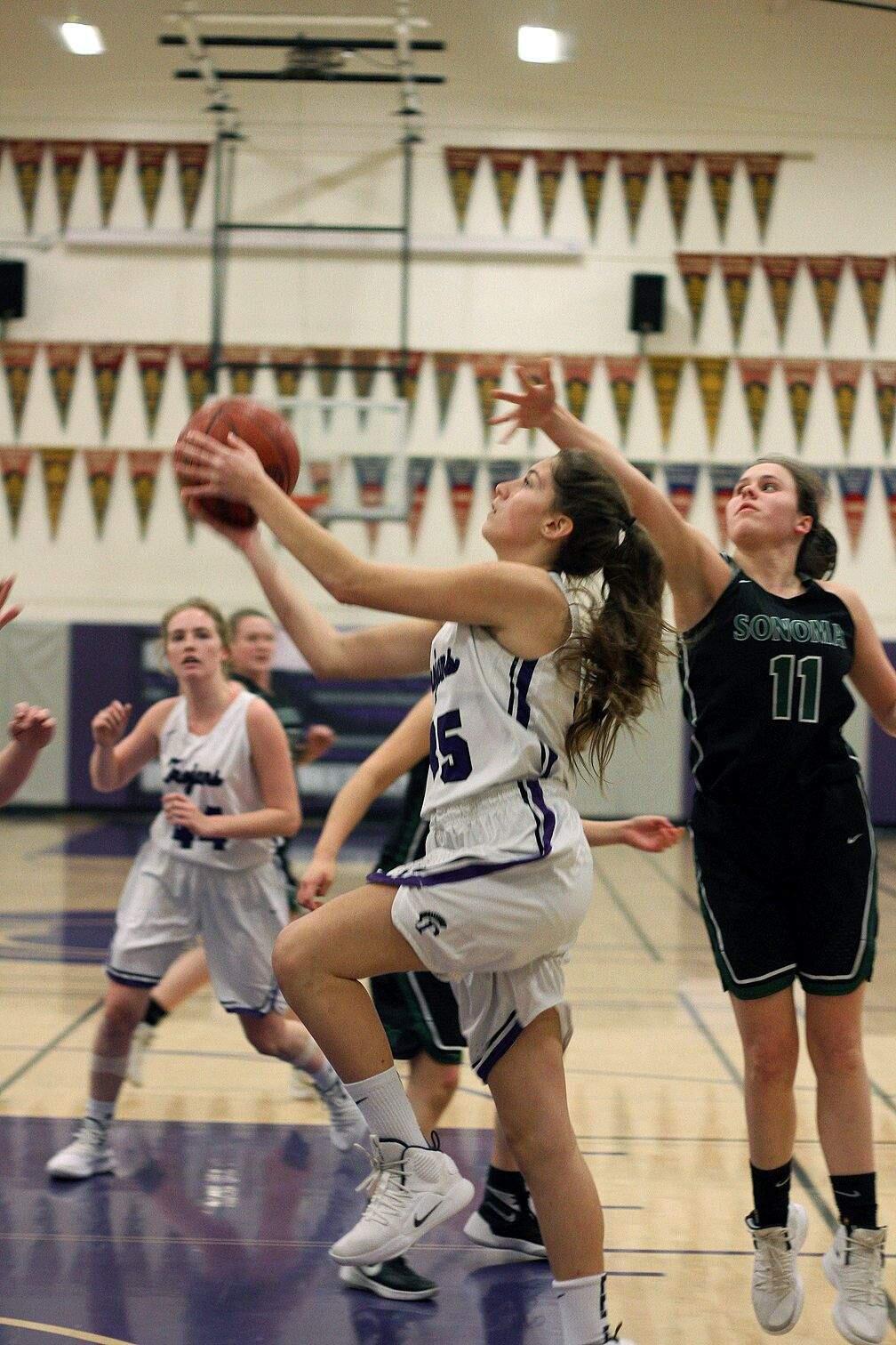 DWIGHT SUGIOKA/FOR THE ARGUS-COURIERPetaluma's Taylor Iacopi drives to the hoop for a basket in Petaluma's win over Sonoma Valley.