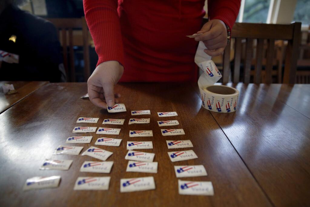 The Sonoma County Registrar of Voters is looking for bilingual speakers to aid in the November general election helping with voter questions and general tasks, including handing out 'I VOTED' stickers. (BETH SCHLANKER/ The Press Democrat)