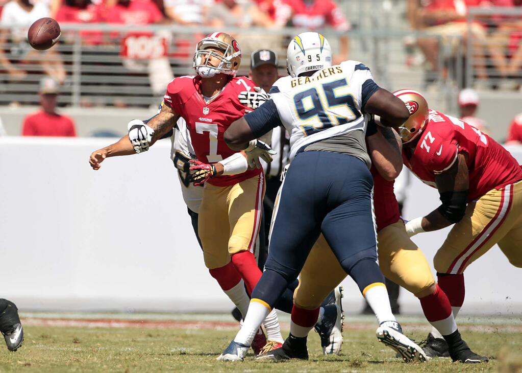 Quarterback Colin Kaepernick fumbles the football in the 1st quarter. The Chargers recovered. The San Francisco 49ers beat the San Diego Chargers, 21-7, in a preseason game on August 24, 2014.