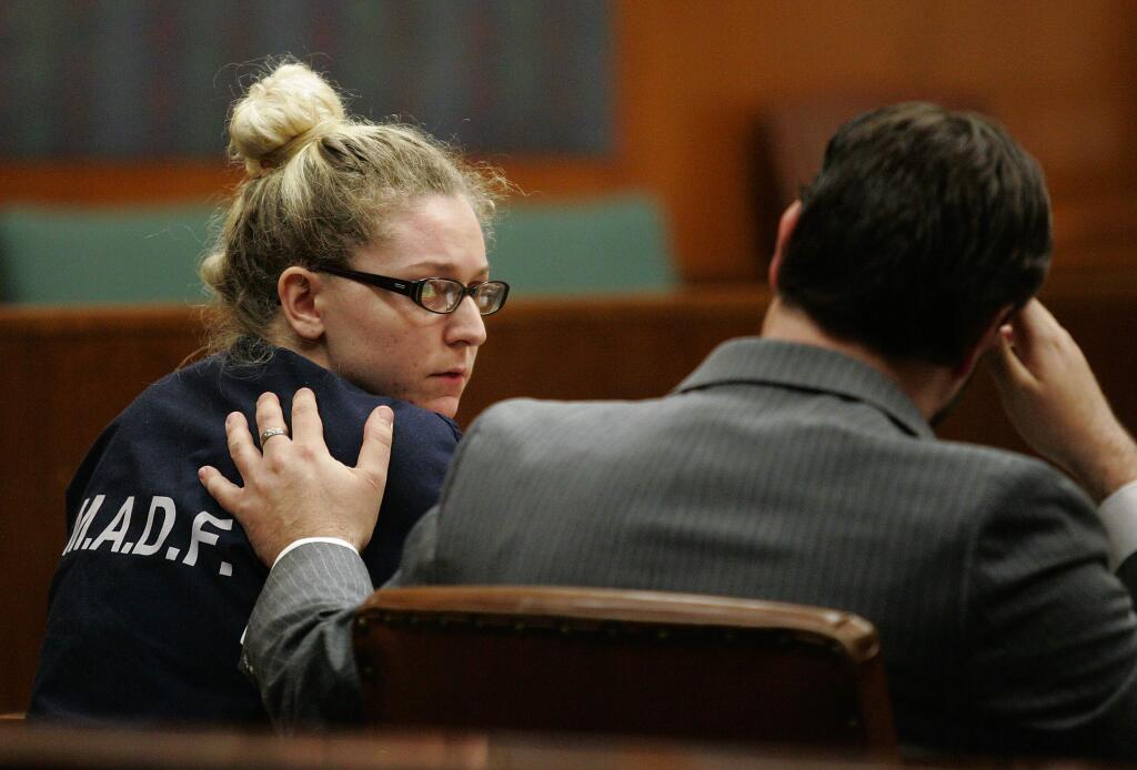 2/22/2013: B1:PC: Former SSU student, 21 year old, Lyndsay Colula is comforted by her attorney after being sentenced in Sonoma County Superior Court in Santa Rosa, Ca. on Thursday morning Feb. 21, 2013, to 11 years in prison in her case for beating her 2 month baby.