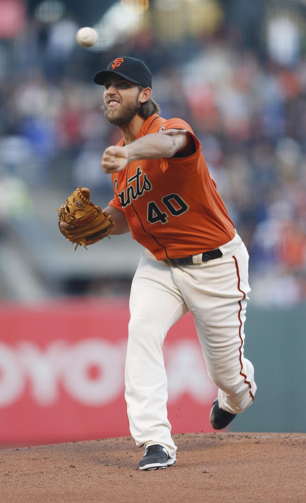 San Francisco Giants pitcher Madison Bumgarner releases the ball during the first inning of a baseball game against the Philadelphia Phillies, Friday, Aug. 15, 2014, in San Francisco. (AP Photo/Beck Diefenbach)