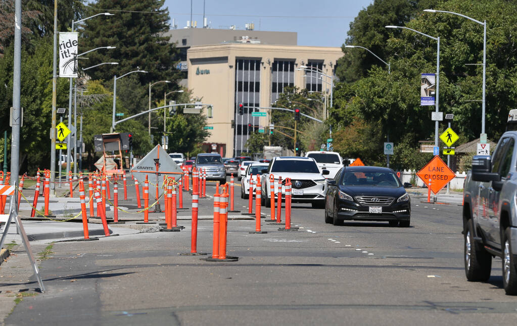 Traffic merges along Santa Rosa Avenue, looking north from Mill Street, in Santa Rosa Monday, Sept. 18, 2023. (Christopher Chung / The Press Democrat)