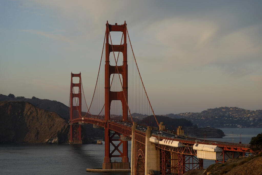 Traffic moves on the Golden Gate Bridge in San Francisco, Thursday, Nov. 12, 2020. (AP Photo/Jeff Chiu)