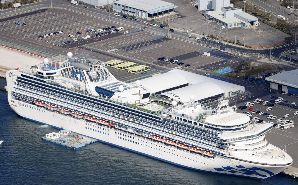 The quarantined Diamond Princess cruise ship is anchored at a port in Yokohama, near Tokyo Wednesday, Feb. 19, 2020. The passengers tested negative for COVID-19 will start disembarking Wednesday. (Yuta Omori/Kyodo News via AP)
