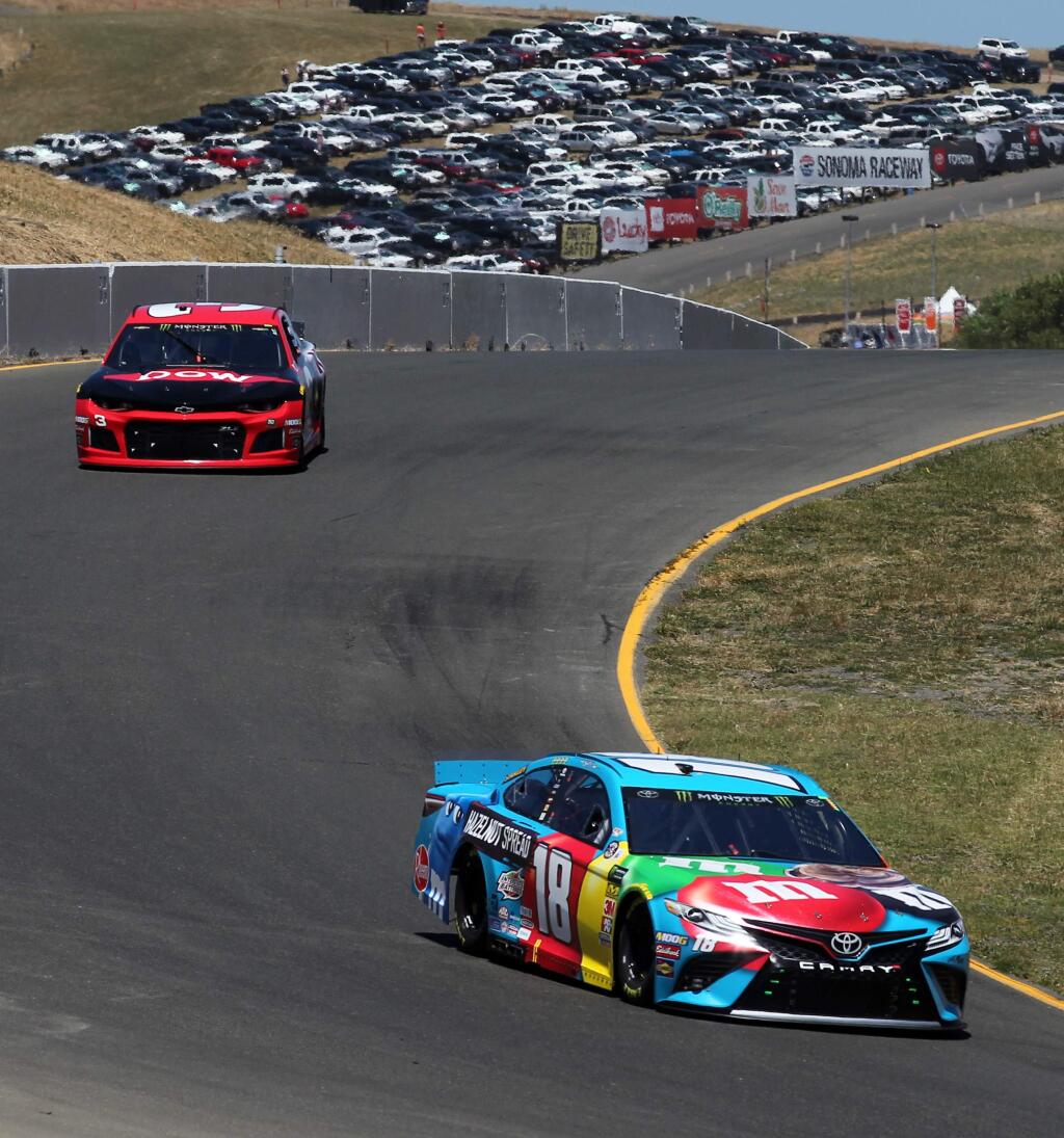 Kyle Busch, in the Hazelnut M&M's Toyota, turns a corner during NASCAR Cup series qualifying at Sonoma Raceway, on Saturday, June 22, 2019. (Photo by Darryl Bush / For The Press Democrat)