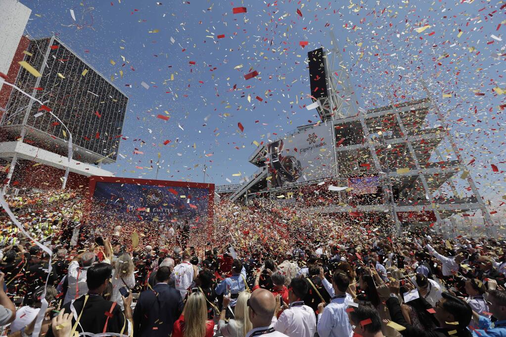 Confetti rains down during the ribbon-cutting and opening of Levi's Stadium Thursday, July 17, 2014, in Santa Clara, Calif. The San Francisco 49ers held a ribbon-cutting ceremony to officially open their new home. The $1.2 billion Levi's Stadium, which took only about 27 months to build, also will host the NFL Super Bowl in 2016 and other major events. (AP Photo/Eric Risberg)