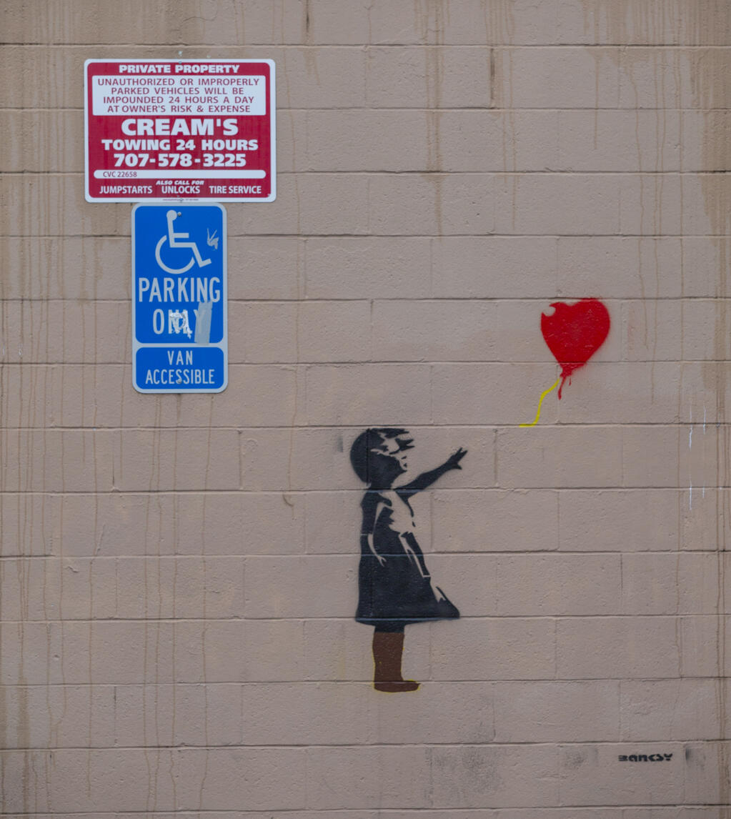 Street art signed by renowned artist Banksy, though not confirmed, seen Saturday, Dec. 3, on the back of Masonic Lodge 181 in Windsor, is thought to have appeared overnight Thursday, Dec. 1, 2022. (Chad Surmick/The Press Democrat)