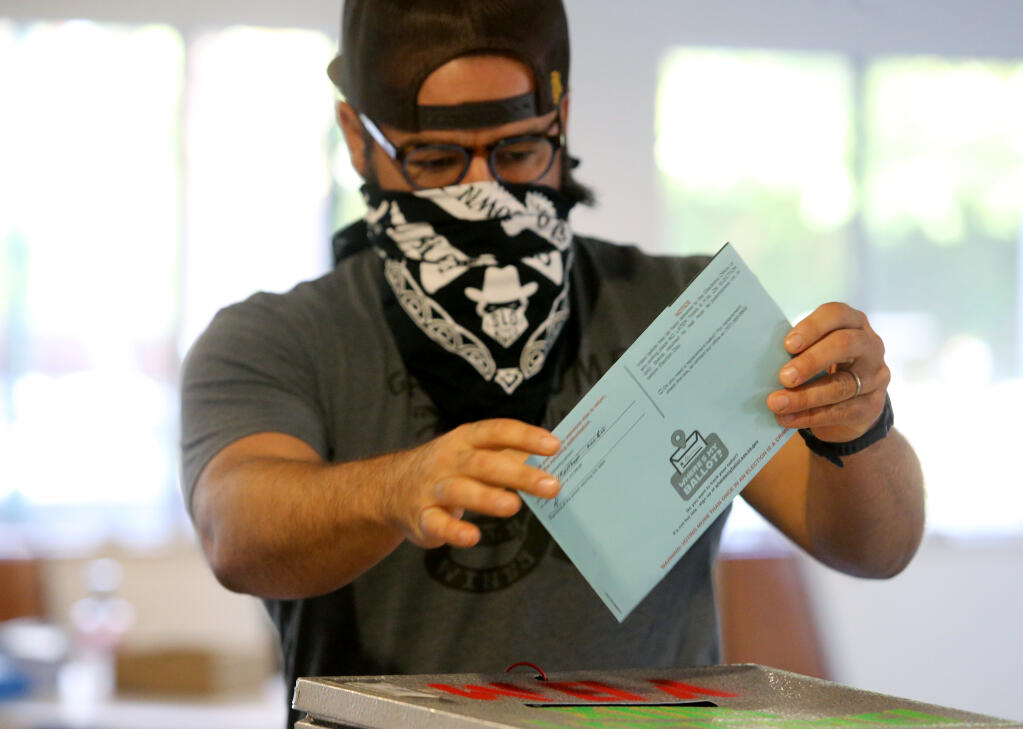 Brandon Allen casts his ballot at Petaluma Christian Church on Tuesday. (BETH SCHLANKER / The Press Democrat)