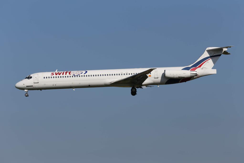 This photo taken on Friday, May 16, 2014 shows an MD-83 aircraft in the livery of Swiftair landing at Zaventem Airport Brussels. An Air Algerie flight carrying over 100 people from Burkina Faso to Algeria's capital disappeared from radar early Thursday over northern Mali after heavy rains were reported, according to the plane's owner and government officials in France and Burkina Faso. Air navigation services lost track of the MD-83 about 50 minutes after takeoff from Ougadougou, the capital of Burkina Faso, at 0155 GMT (9:55 p.m. EDT Wednesday), the official Algerian news agency APS said. Air Algerie Flight 5017 was being operated by Spanish airline Swiftair, the company said in a statement. The Spanish pilots' union said the plane belonged to Swiftair and it was operated by a Spanish crew. (AP Photo/Kevin Cleynhens)